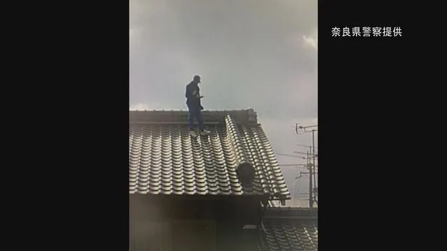 Image of a roof with a person on it